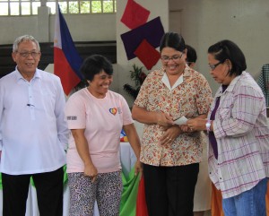 Nenian Silao, president of Sampaguita SKG, barangay Balungagan, is all smiles as she waited for the check to be given to her by ARDO Mita G. Lim through Mayor Avelina S. Rosales (1st and 2nd from left) while Vice Mayor Manuel N. Biong looks on.