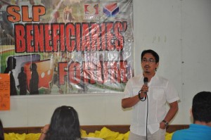 SLP Head Roy Serdeña enthusiastically discusses matters about SLP to the beneficiaries during the SLP Forum.