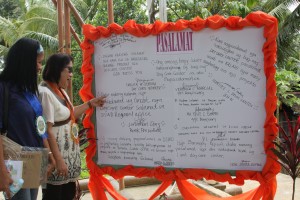 RD Brigoli with MSWDO Marilou M. Godito read the PASALAMAT of the village people displayed on their freedom wall.