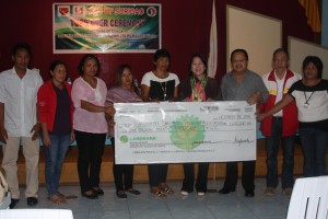 DSWD Regional Director Minda B. Brigoli (in brown jacket) with Surigao City Mayor Ernesto T. Matugas, City Administrator Atty. Manuel Corro and SEA K Association presidents during the SLP check turn- over ceremony for the newly funded microenterprise projects.