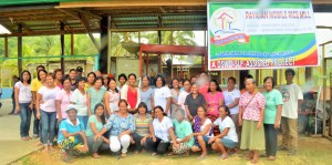 GRATEFUL FOR THE MOBILE RICE MILL. The members of Brgy. Payasan PAMANA Association pose with their most awaited rice mill.
