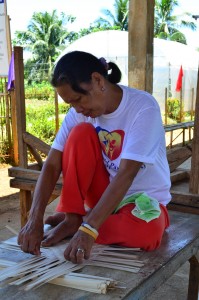INTERLACING POSITIVE CHANGE. A member passionately weaves the bamboo strips to produce a good quality handicraft. 
