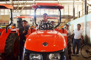 Grateful face of Boniface D. Caῆal, Association President of Tiwi Farmers and Fisherfolks Association inside the newly handed tractor.  
