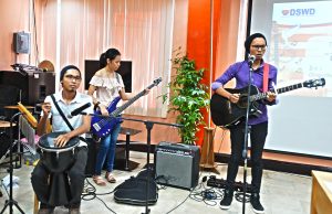 One Team. Gospelaire M. Abarquez (vocals/lead guitar), Eden T. Pabia (bass guitar), and Jireh M. Abarquez (percussion) perform their winning song composition titled “One” during the Kalahi-CIDSS  Songwriting Competition Grand Finals live performance held at DSWD Caraga’s Conference Hall, Butuan City. 